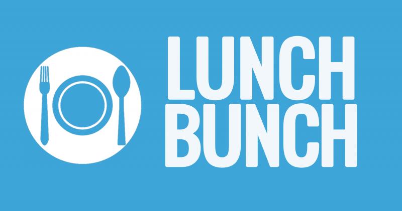 Blue background with white place setting that reads Lunch Bunch